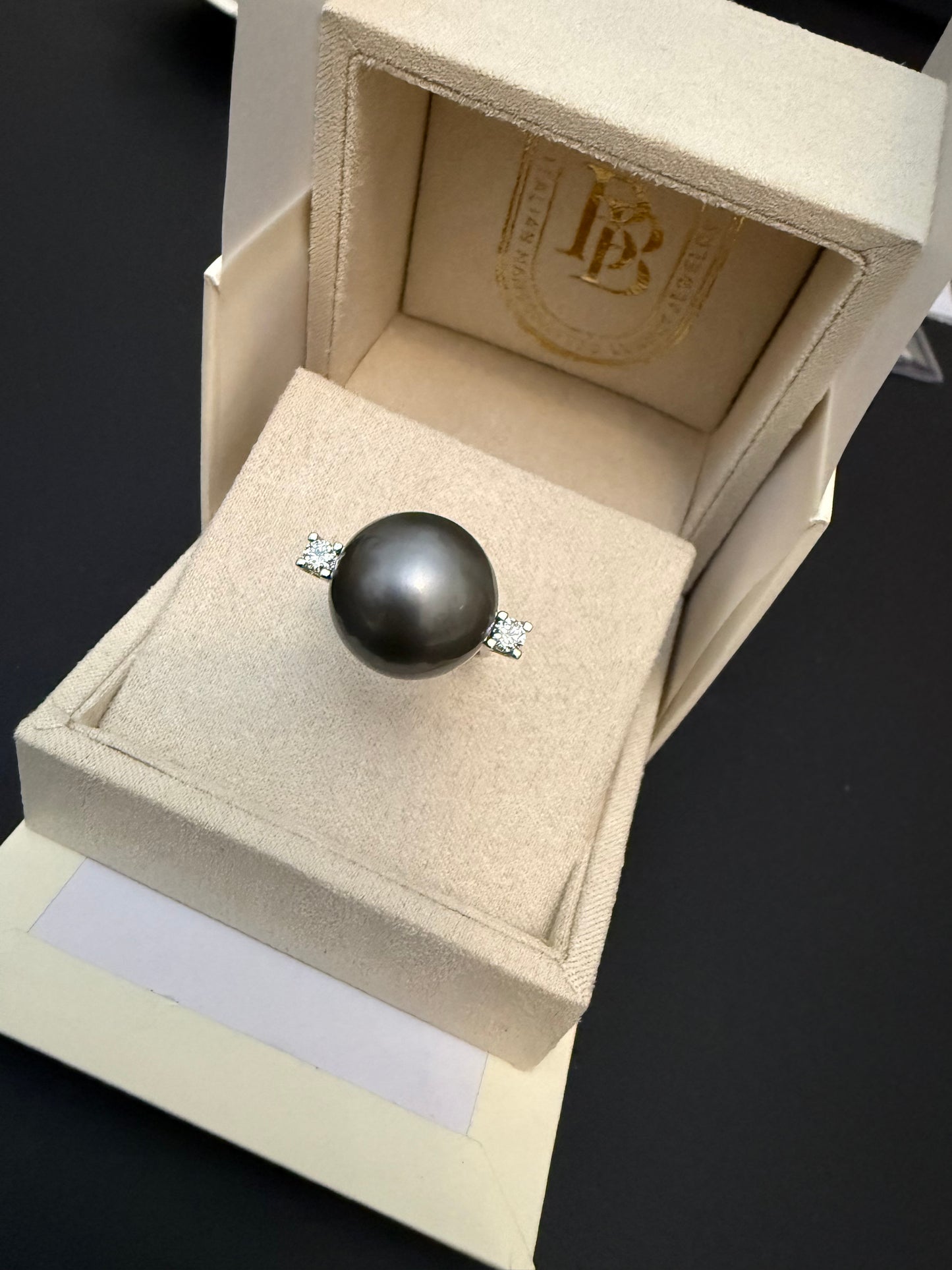 Ring with giant Tahitian pearl and two diamonds