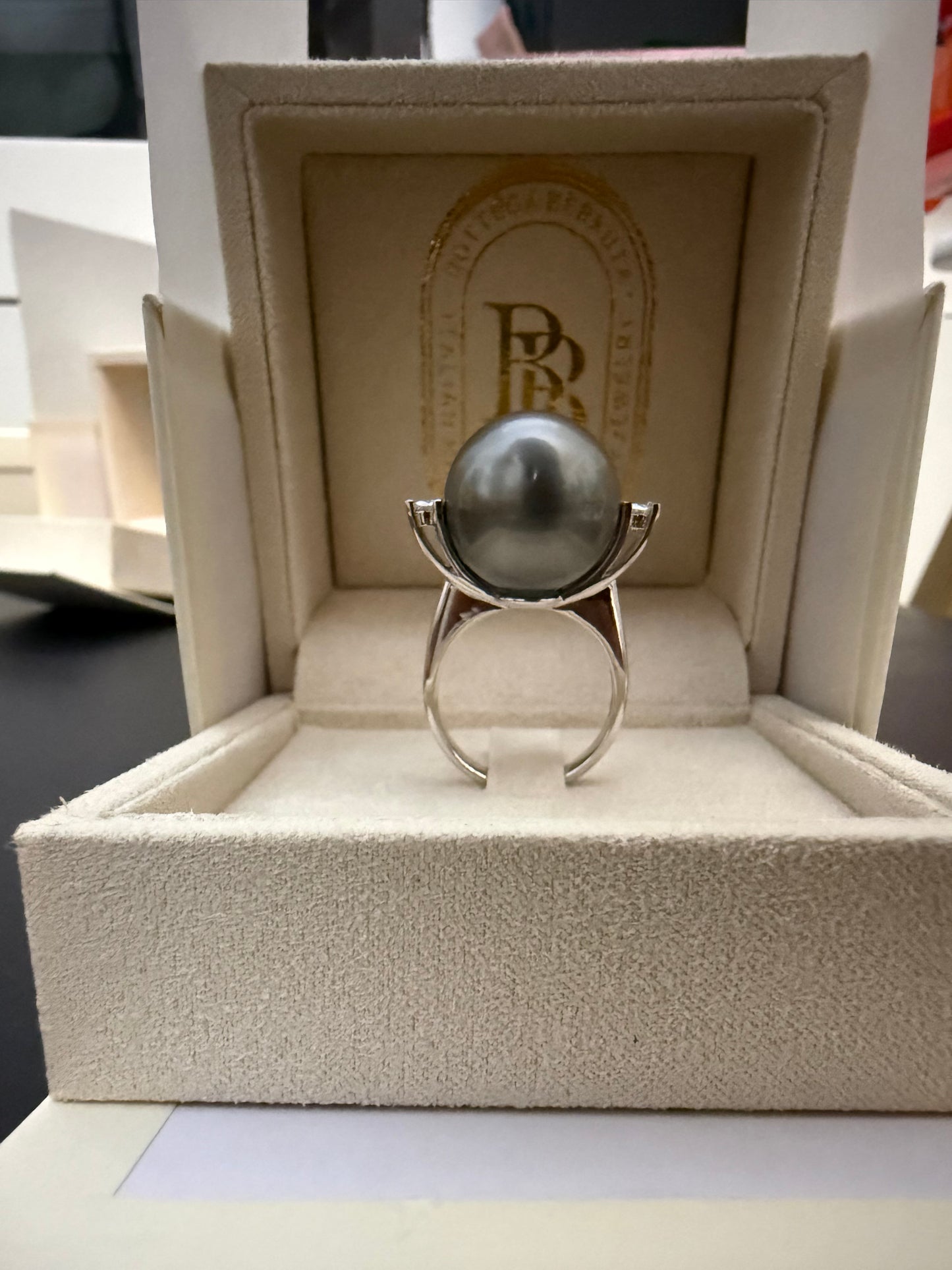Ring with giant Tahitian pearl and two diamonds