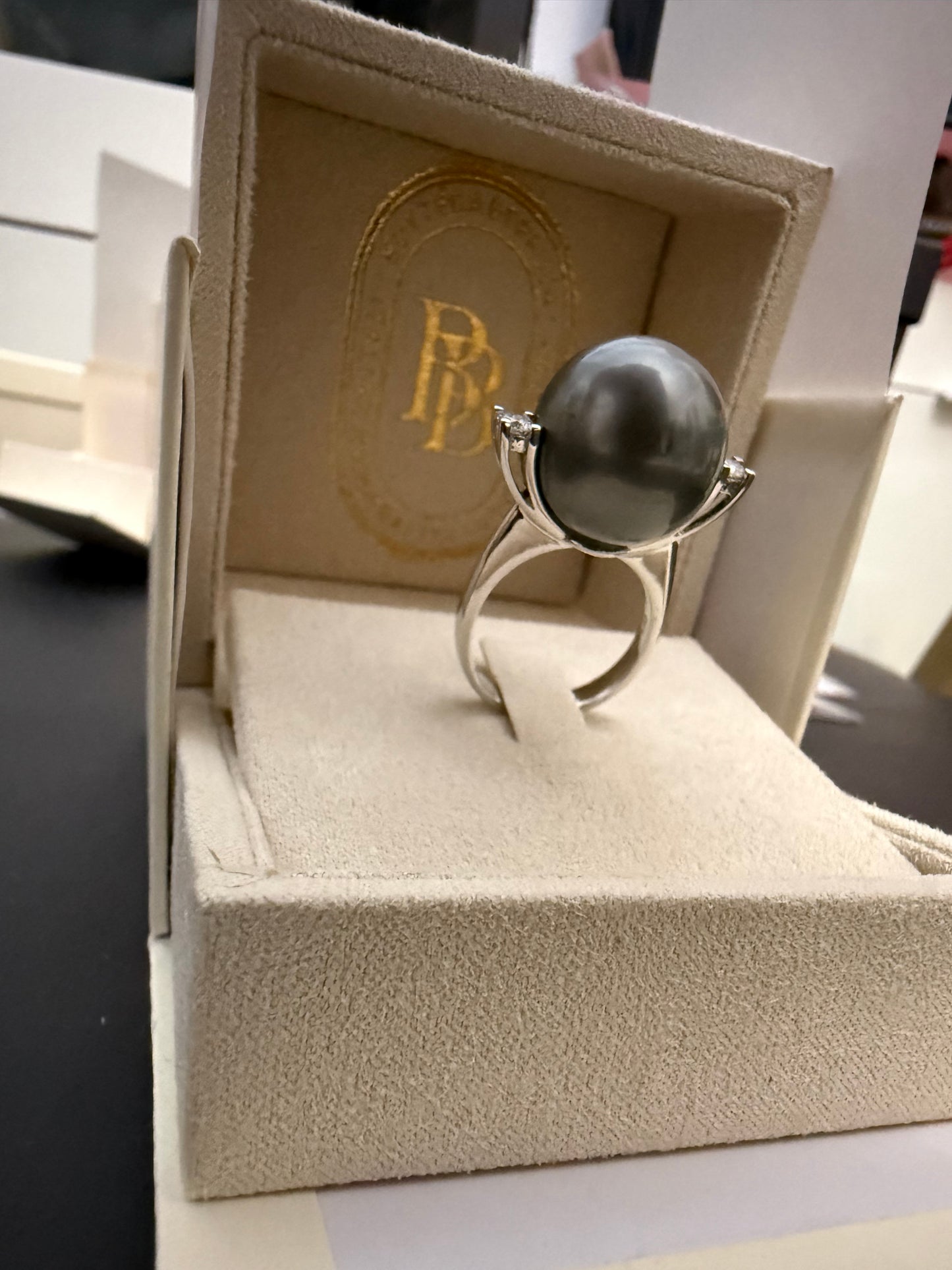 Ring with giant Tahitian pearl and two diamonds