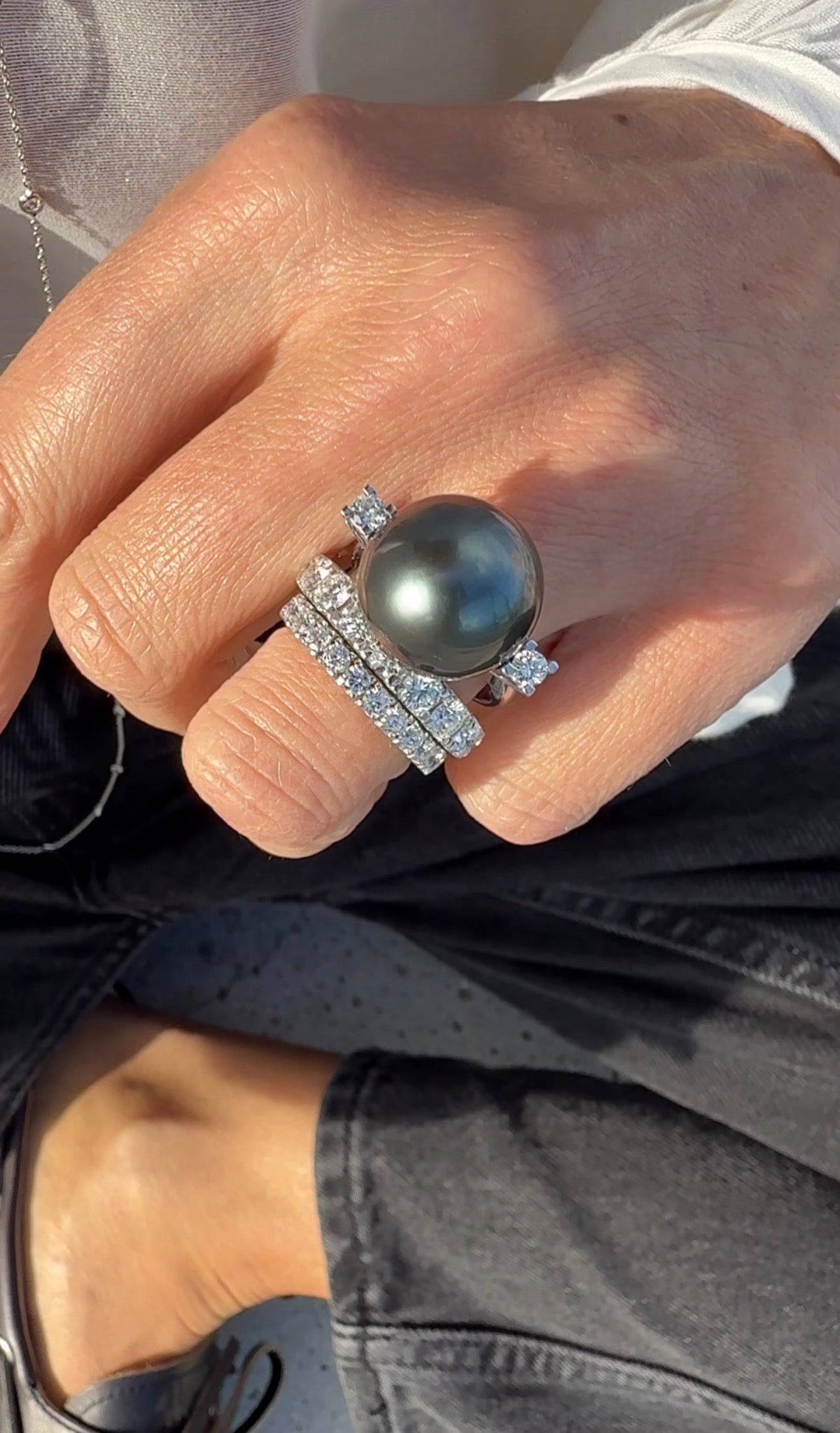Ring with giant Tahitian pearl and two diamonds