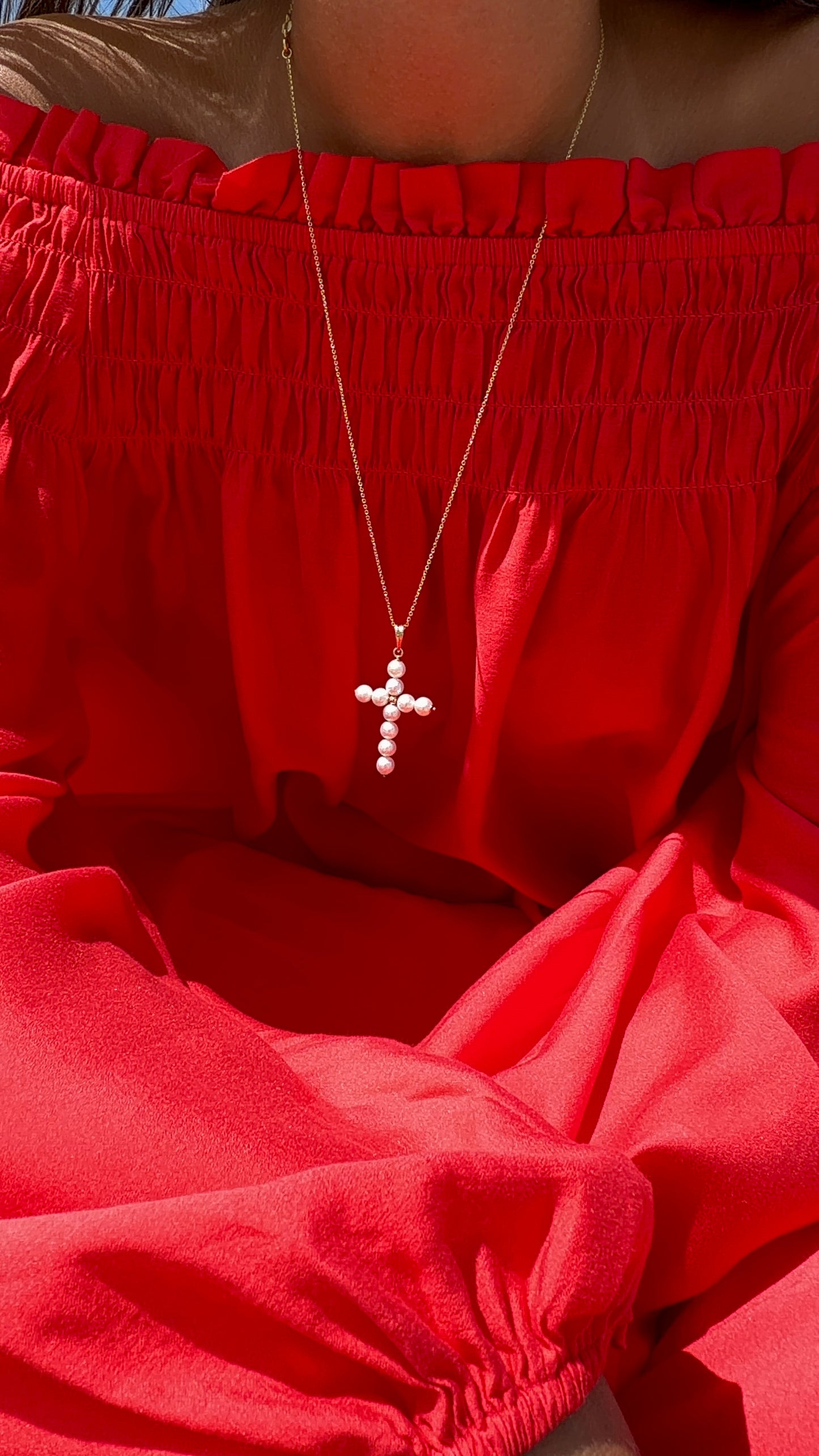White pearl cross in gold